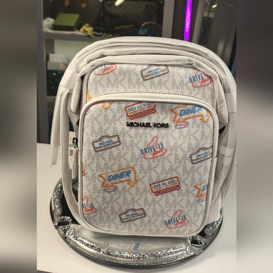 Michael Kors Jet Set Travel Medium Crossbody Bag with a diner-themed signature